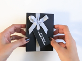 Gift box with optional ribbon + tag.